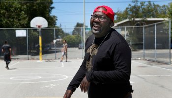 Rapper Mistah F.A.B. shoots hoops at Linden Community Park, where he spent his days as a youth, in Oakland, Calif. on Wednesday, June 29, 2016