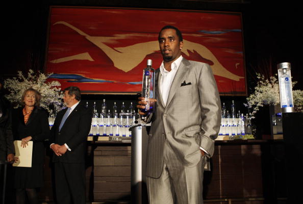 Sean "Diddy" Combs holds a bottle of Cir