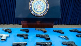 Guns confiscated from gang members on display during...