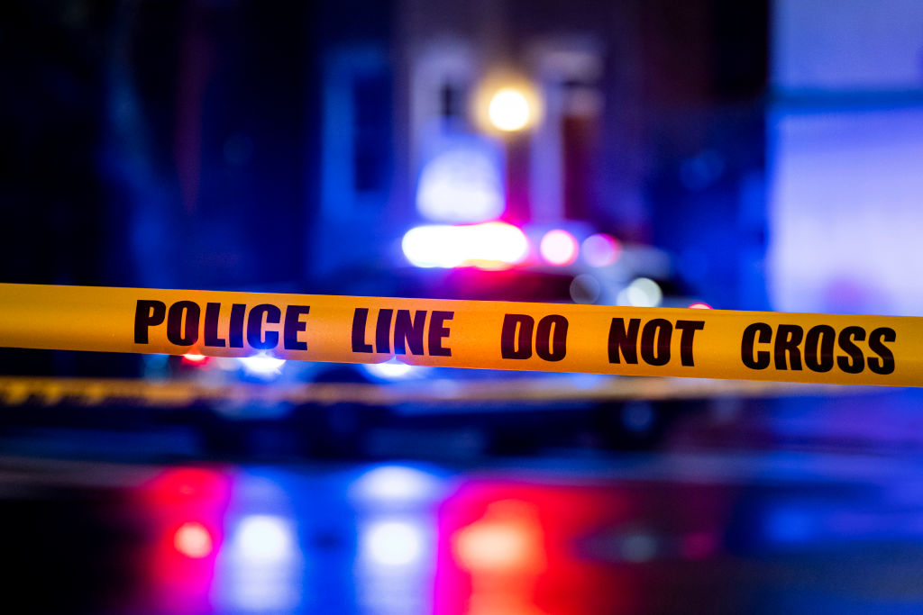 WASHINGTON, DC - MARCH 12: Caution tape hangs as members of the