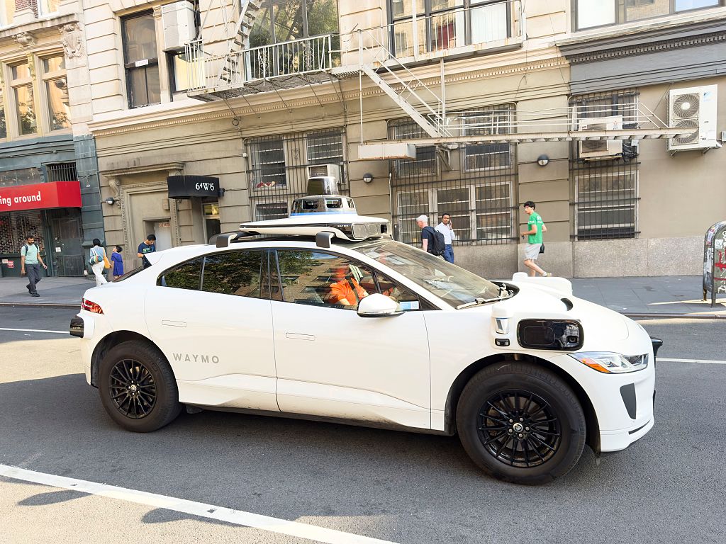 Waymo driverless test car, a Jaguar I-PACE electric vehicle and street scene, Manhattan, New York City, New York, USA