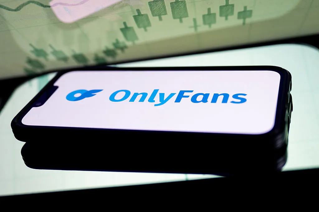In this photo illustration, a OnlyFans logo seen displayed...