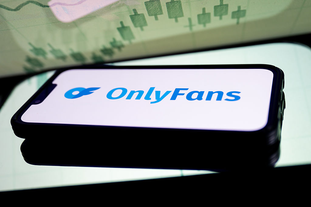In this photo illustration, a OnlyFans logo seen displayed...