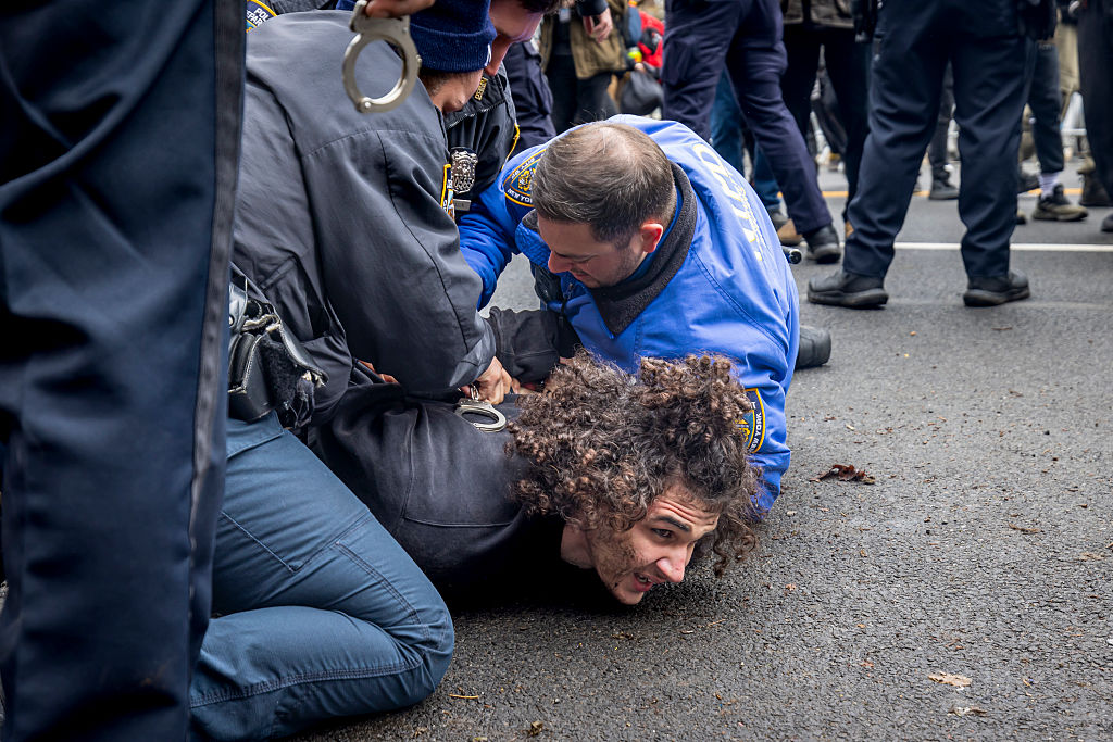 Emir Balat, 18, is arrested after throwing an alleged