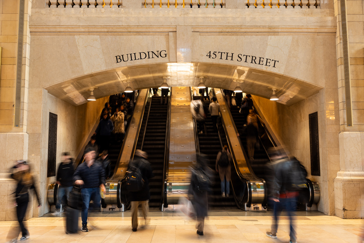 Busy Escalators Under 45th Street Building Arch