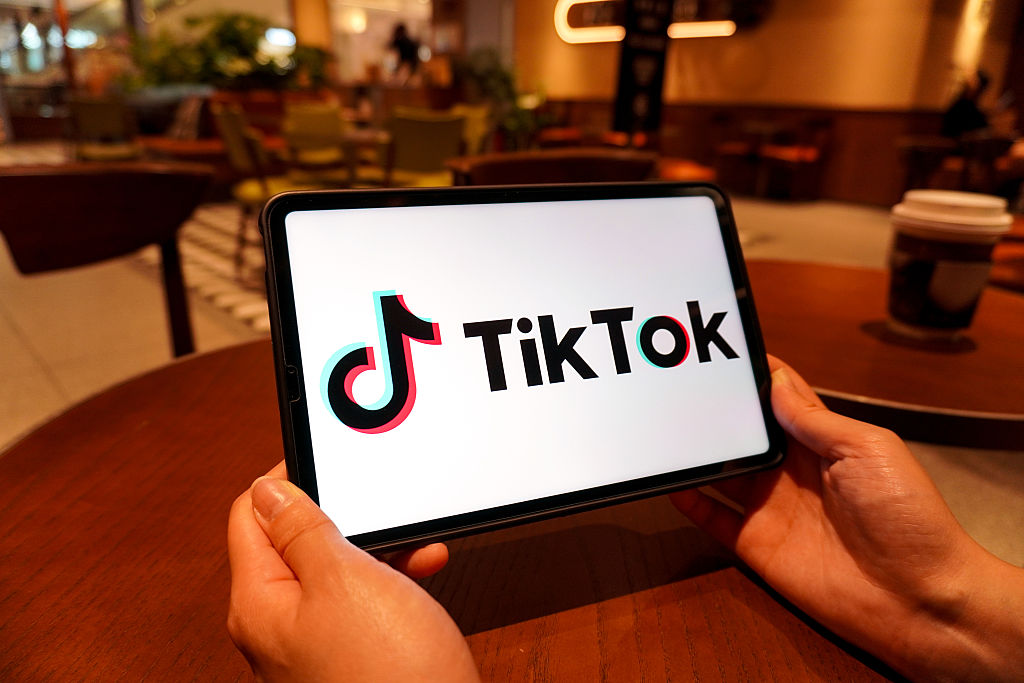 In this photo illustration, the TikTok logo is displayed on