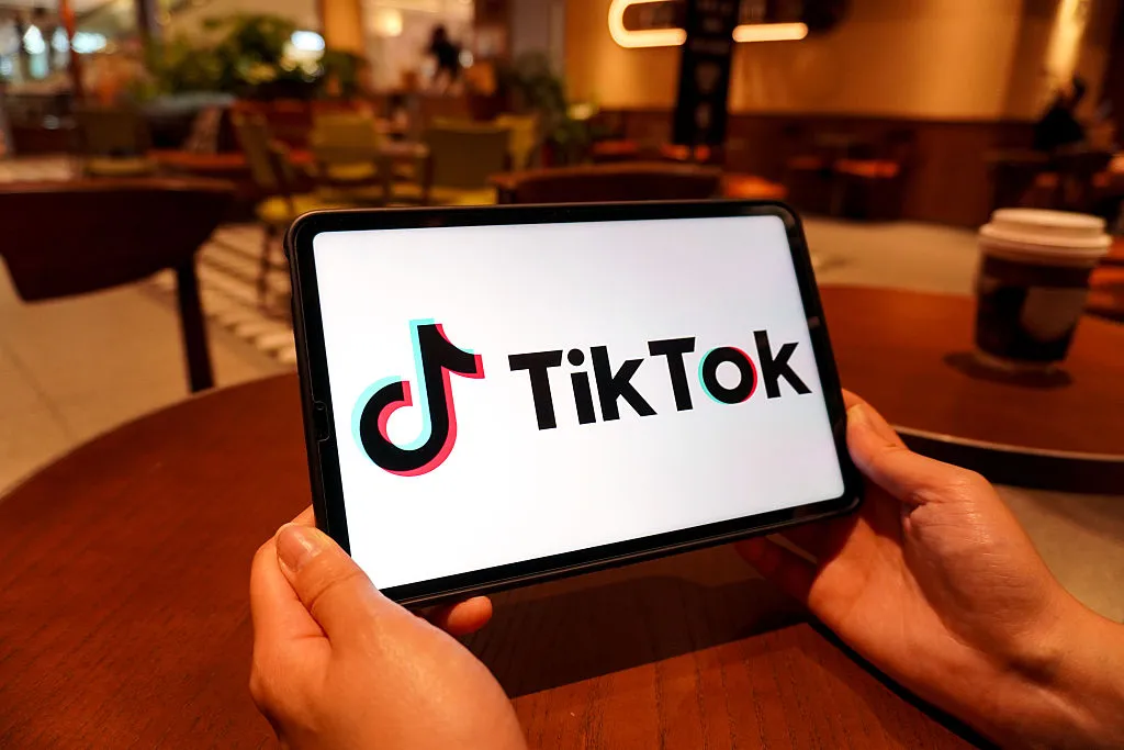 In this photo illustration, the TikTok logo is displayed on
