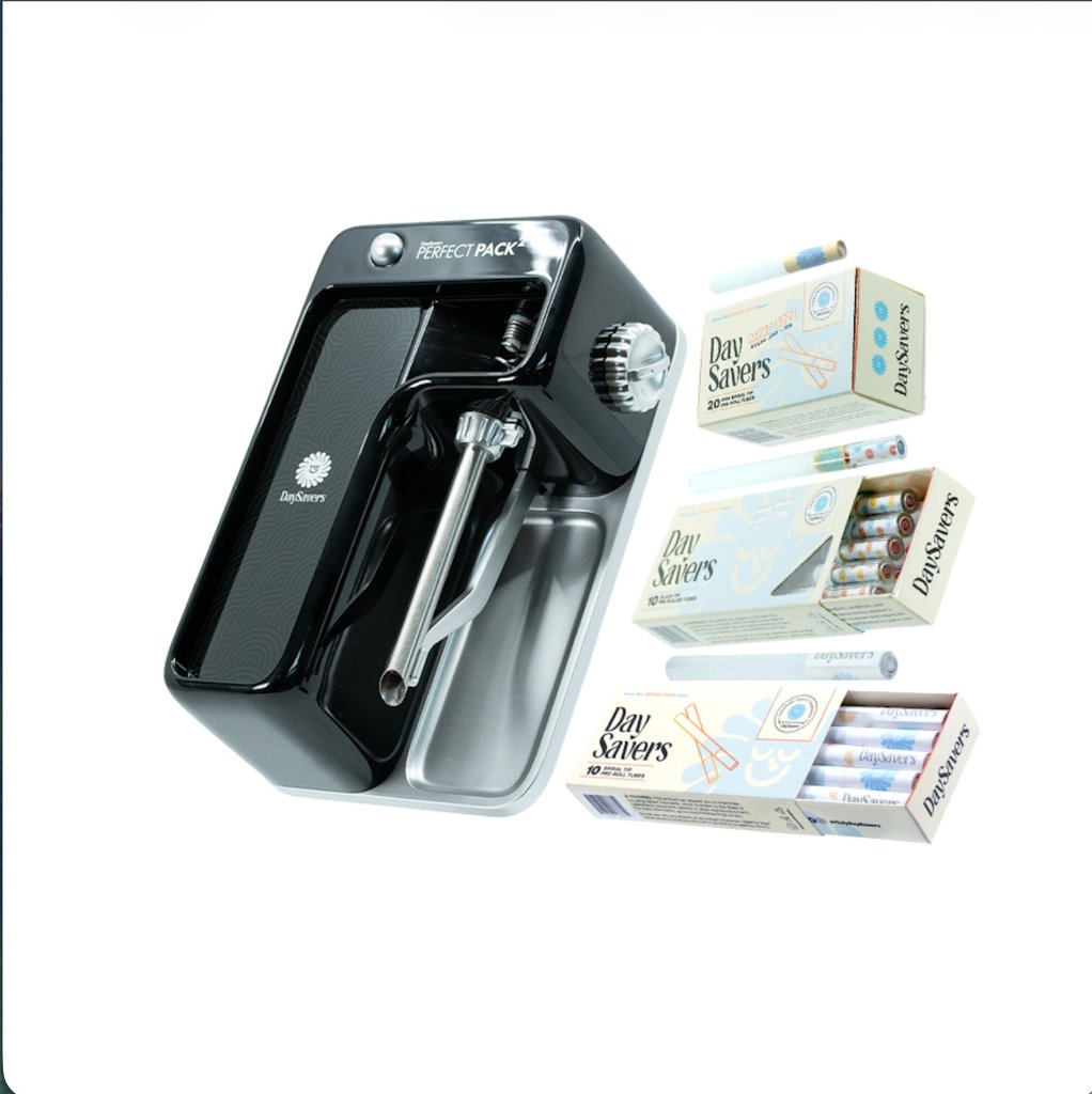 A black Perfect Pack device with a Day Savers box and several other Day Savers product packages.