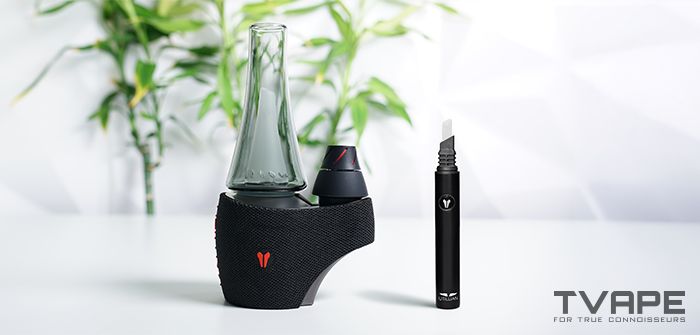 A black vape device with a glass tank and a black vape cartridge.