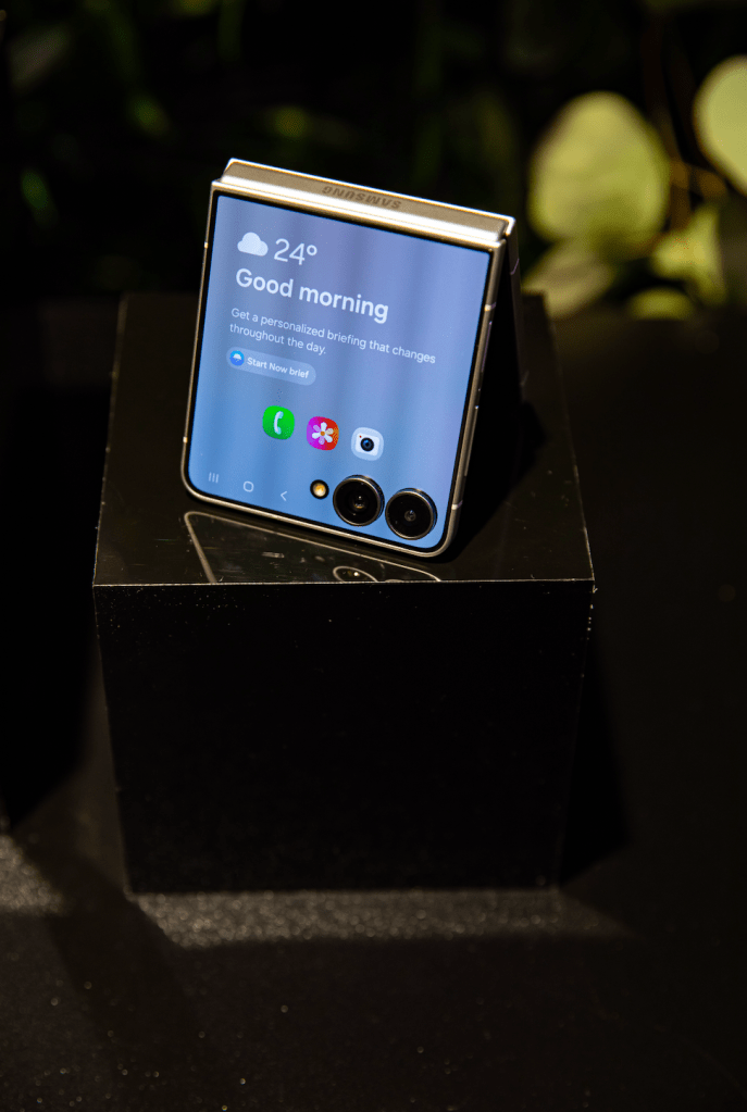 A smartphone display showing the time, temperature, and a "Good morning" message.