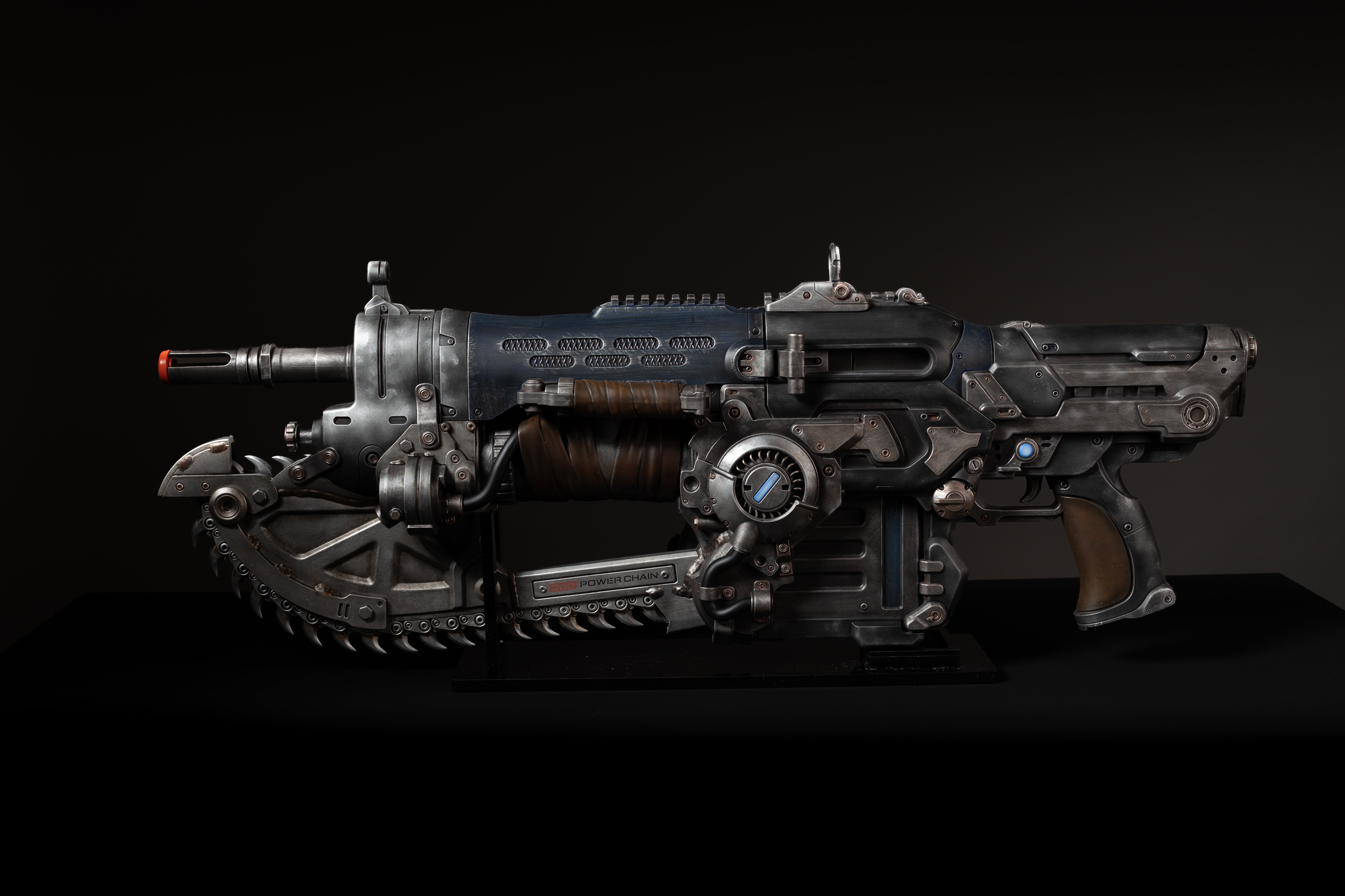 A high-tech, futuristic-looking firearm with various mechanical components and details.