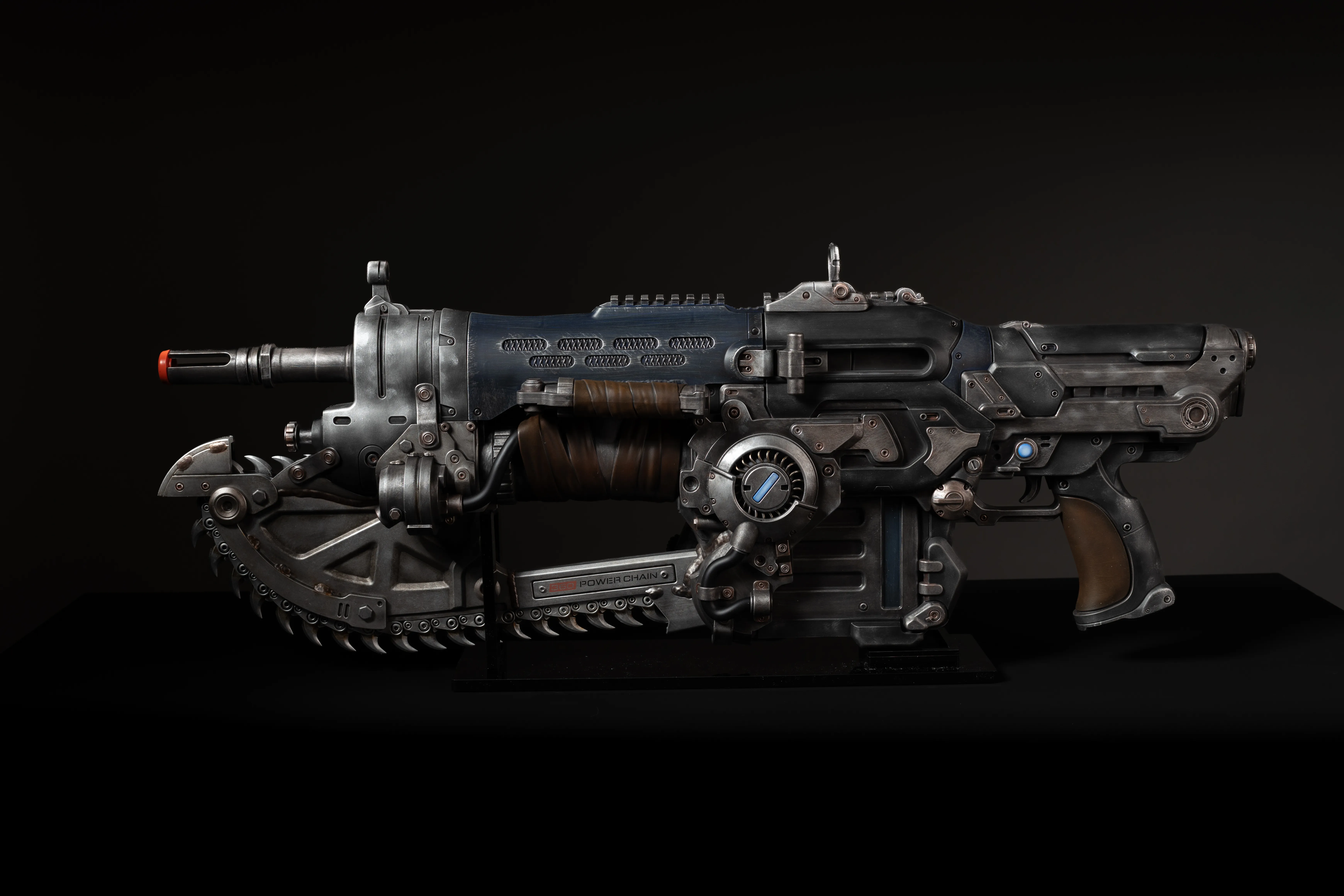 A high-tech, futuristic-looking firearm with various mechanical components and details.